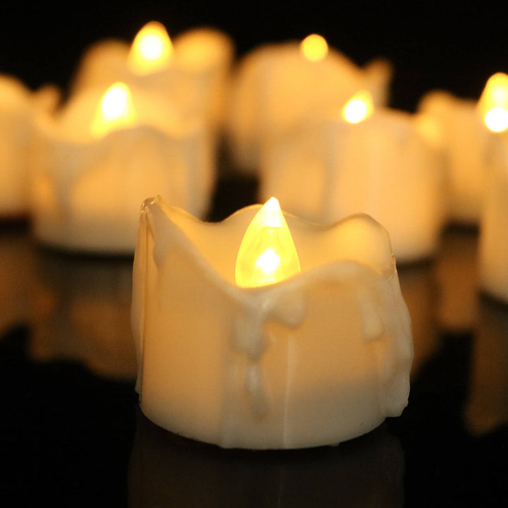 Safe flameless LED candles, 12-pack with realistic flickering. Ideal for romantic lighting & event decor, battery operated.