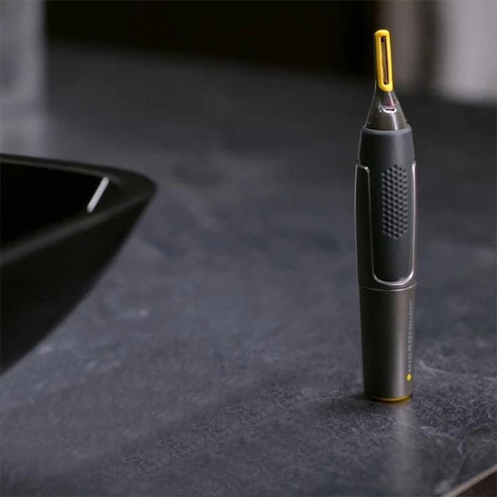 Men's electric beard trimmer with glowing LED and robust Titanium blades for superior control and comfort.