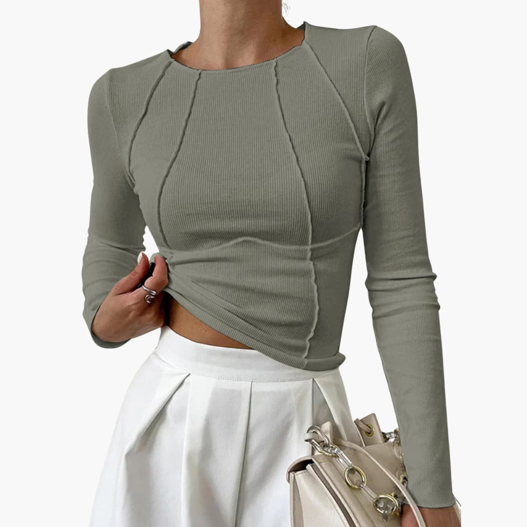 Elegant women's sculpted long sleeve top. Features a flattering seam design, great for any occasion.