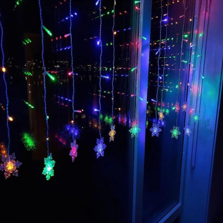 Versatile LED snowflake fairy lights, suitable for both indoor & outdoor holiday decor.