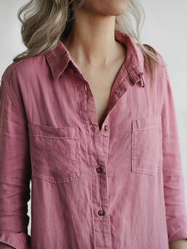 Detail shot of chic women's long sleeve jumpsuit with decorative button-front closure & relaxed fit.