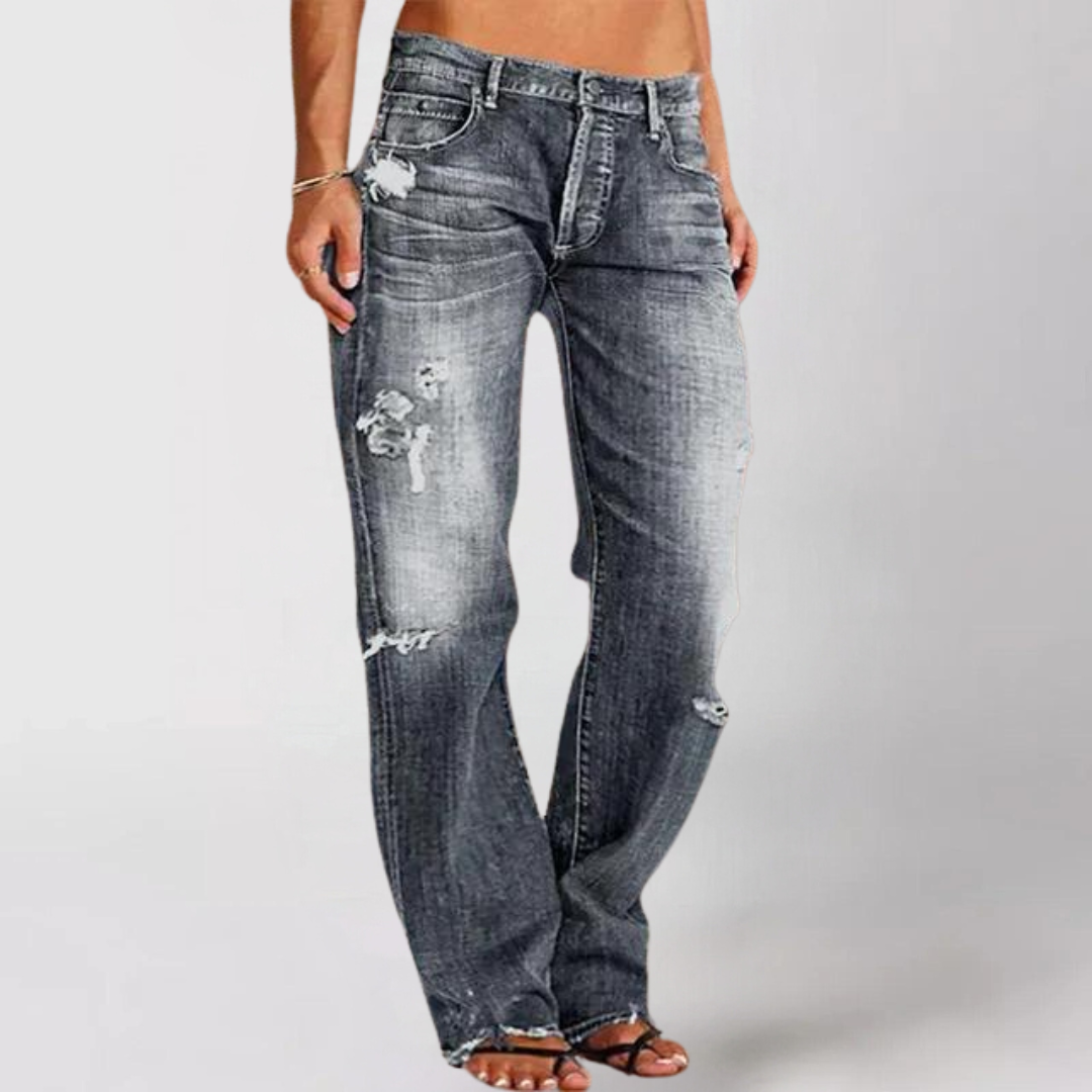 Close-up of comfortable, loose-fit wide-leg women's denim jeans. Essential low-rise casual pants for fashion.