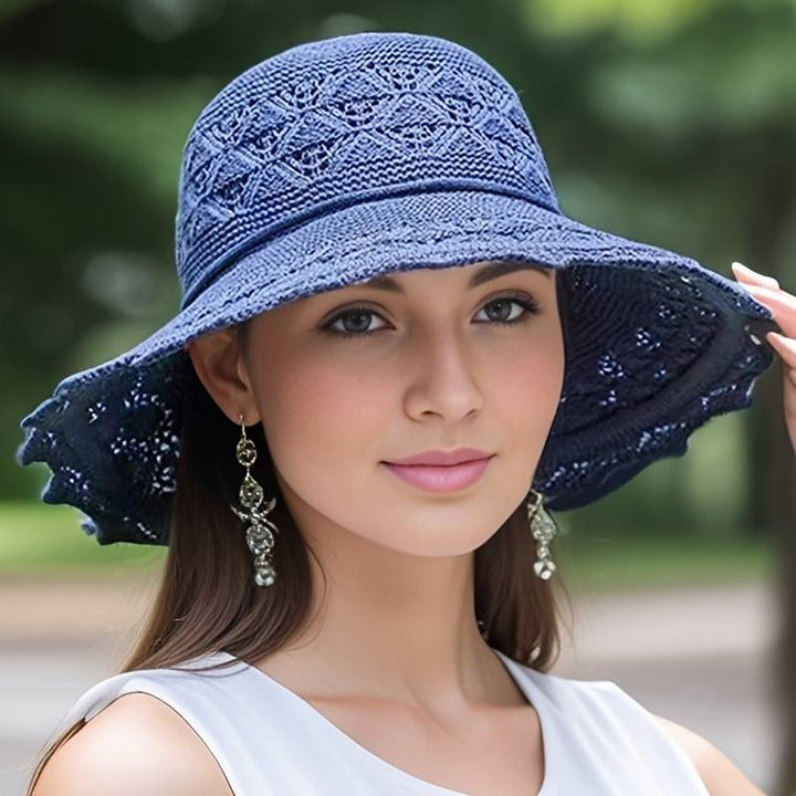 Chic women's wide-brim sun hat, a must-have travel & vacation accessory. Offers stylish UV protection.