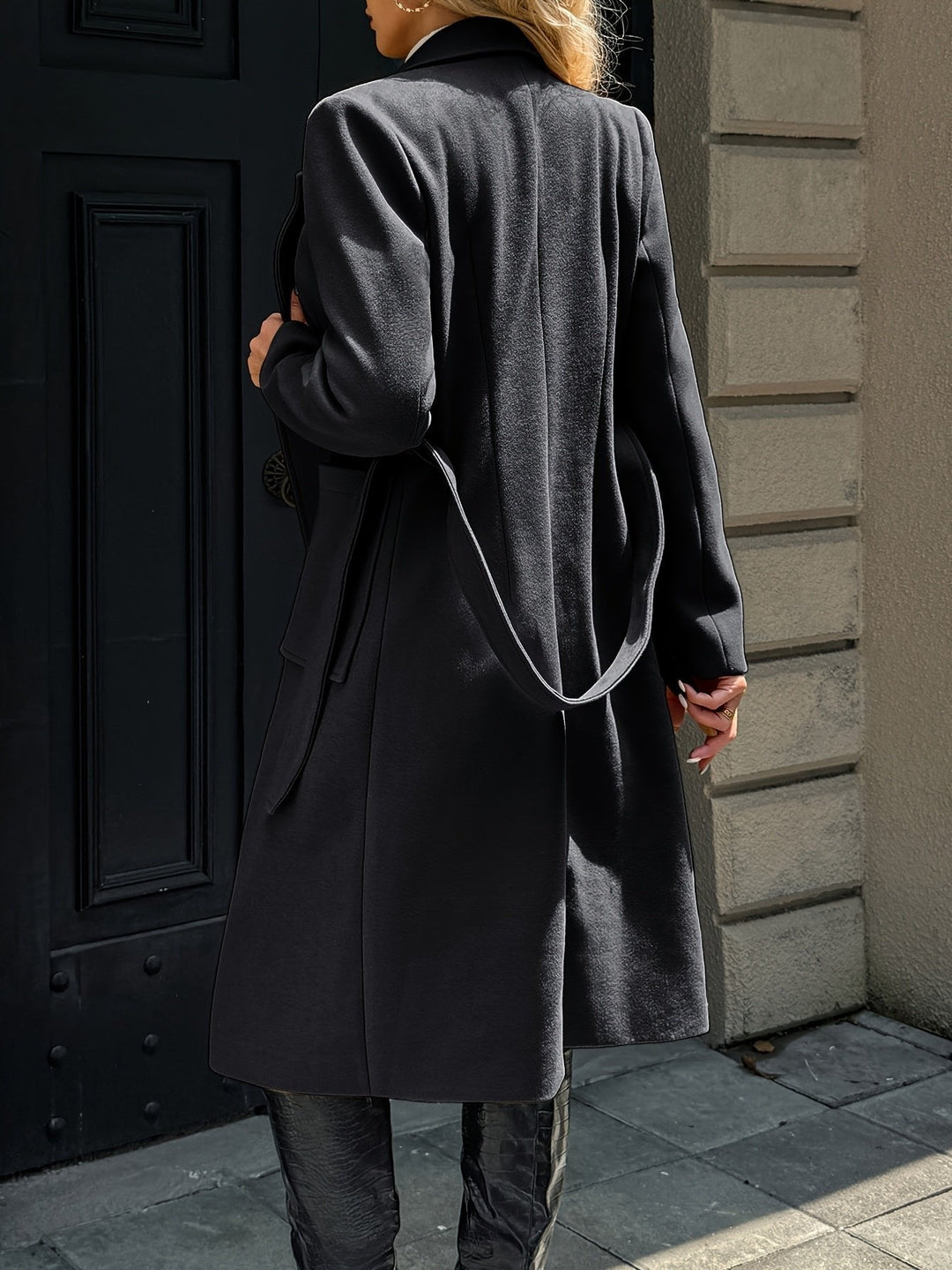 Woman walking in a long belted trench coat. Elegant tailored style, perfect for fall and spring.