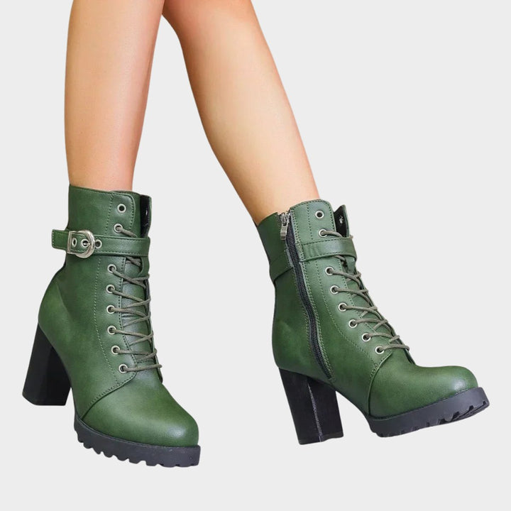 Women's lace-up combat boots with a fashionable block heel, ideal for adding an edgy touch to outfits.