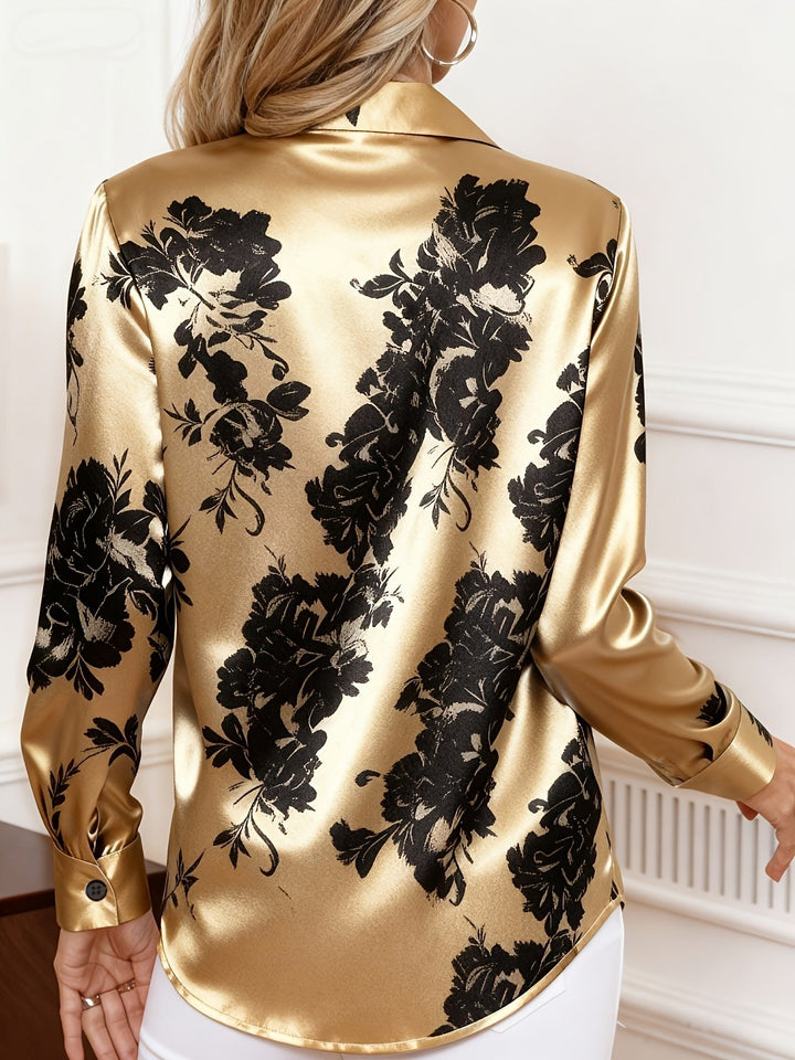 Fashionable women's blouse with an elegant floral print, long sleeves, and a classic collar. Perfect for spring.