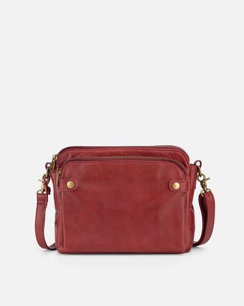 Women's organizer leather crossbody bag with secure zippers, a versatile and essential handbag.