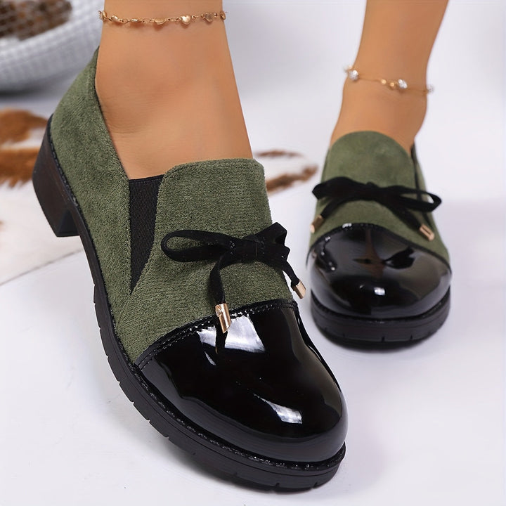 Elegant black women's comfort loafers, featuring a stylish bow and low heel for versatile wear.