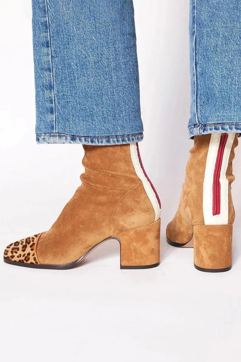 Elegant women's ankle boots, black with a striking leopard print patterned toe and stable block heel.
