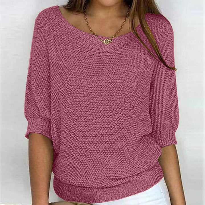 Women's cozy oversized batwing sleeve sweater in a relaxed knit, ideal for fall & winter fashion.