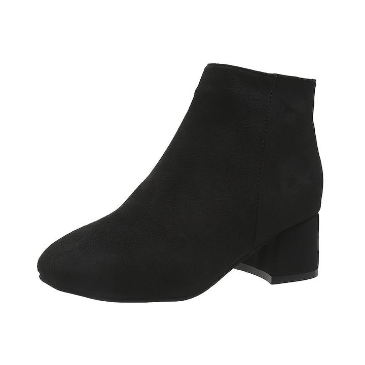 Elegant women's Chelsea ankle boots, offering stylish comfort with a practical block heel. Versatile fall footwear.