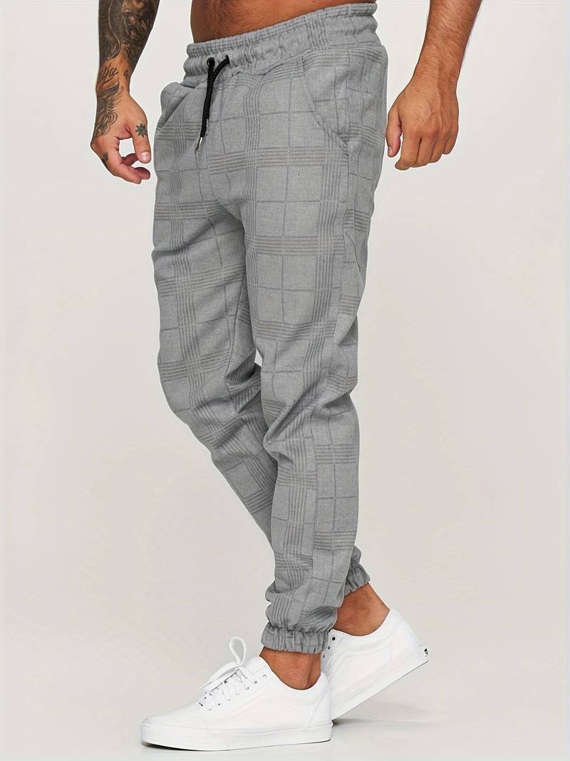 Comfortable men's modern checked jogger pants with a relaxed fit, great for travel and daily wear.