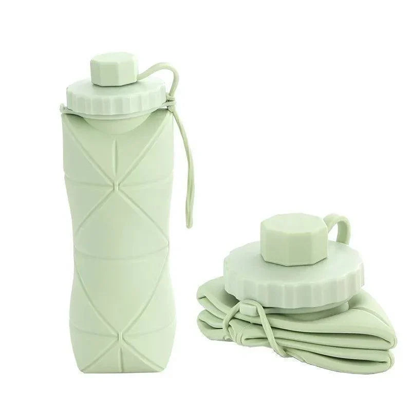 Collapsible 20 fl oz silicone water bottle, unisex design for travel, sport, and daily hydration.