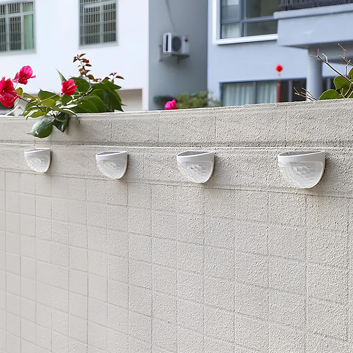 Wireless solar LED wall light for outdoor use. Waterproof, energy-efficient, and automatic garden lamp.