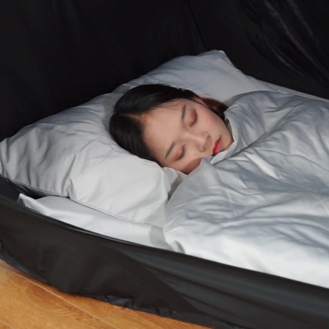 Comfortable CozyNest tent bed for protection against elements & insects, a portable sleep solution.