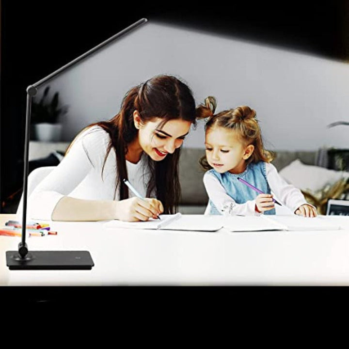 Modern foldable LED table lamp, USB powered, with touch control for dimmable light. Ideal for office or bedroom.
