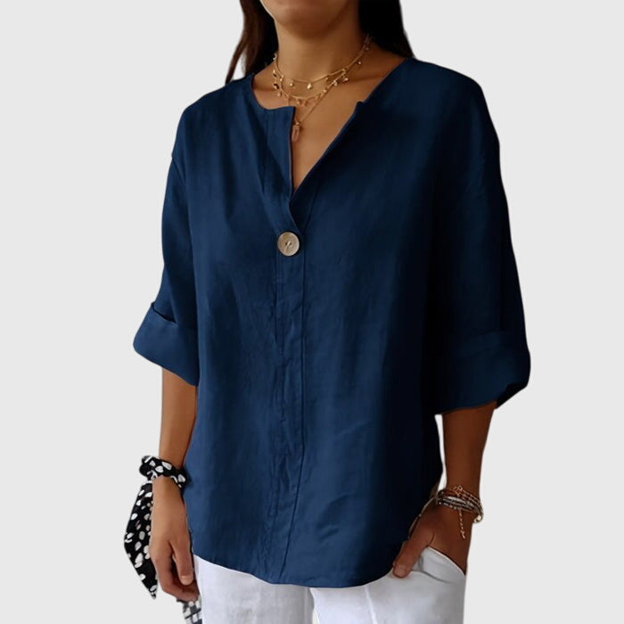 Chic V-neck women's blouse featuring a stylish single button and long sleeves, ideal for versatile office or casual wear.