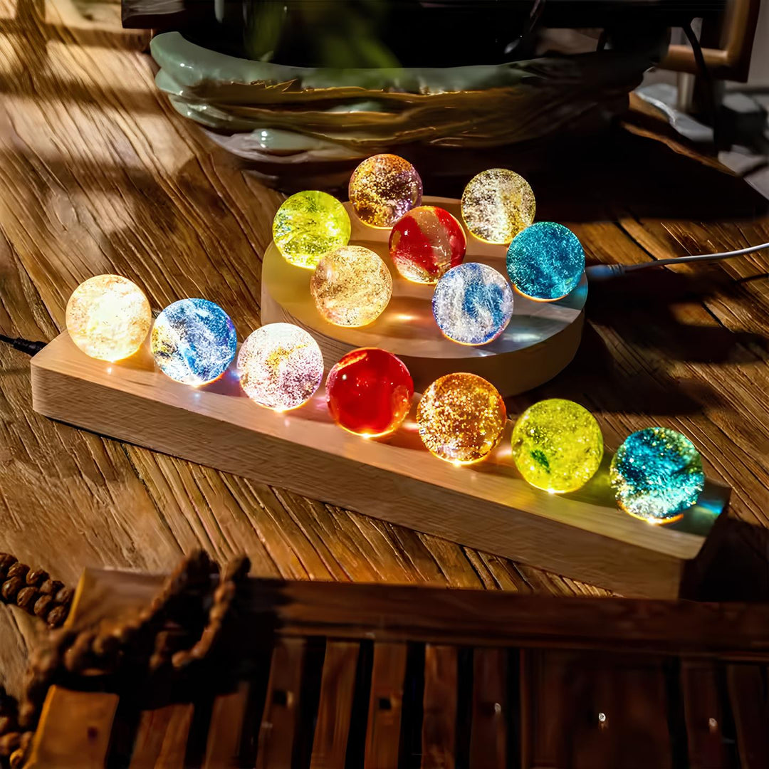 Luminous crystal galaxy orb set on a wooden LED base, perfect for celestial home decor.