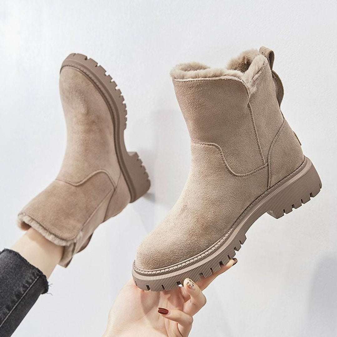 Women's cozy slip-on winter ankle boots, perfect for warmth and easy wear.