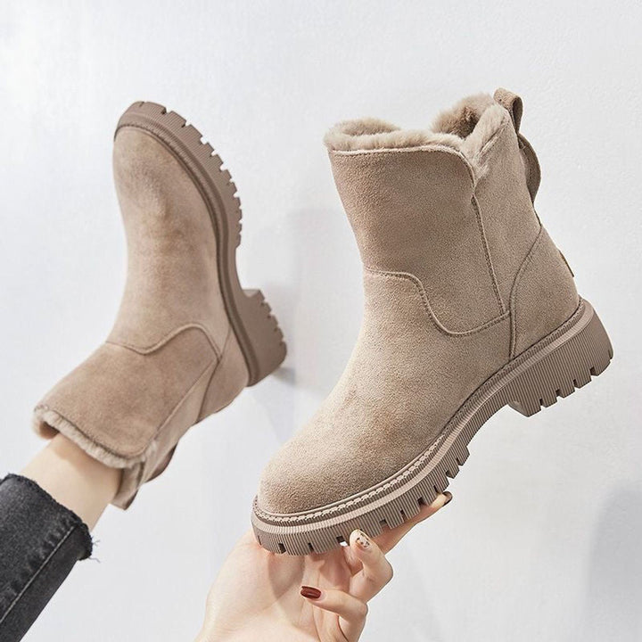Women's cozy slip-on winter ankle boots, perfect for warmth and easy wear.