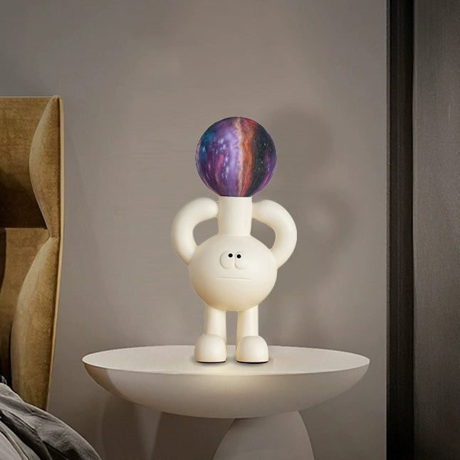 Accent lighting from a unique frosted glass globe table lamp, ideal for a bedroom or desk.