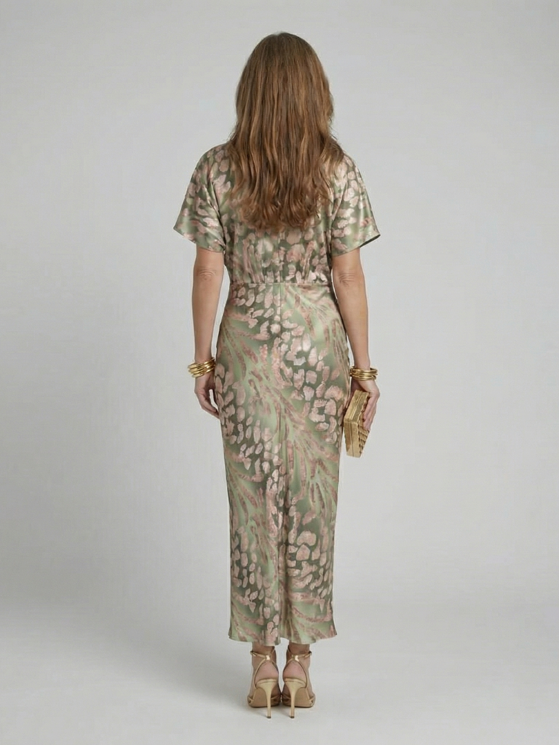 Flattering short sleeve women's green abstract print midi dress with a stylish V-neck and twist waist, perfect for spring.