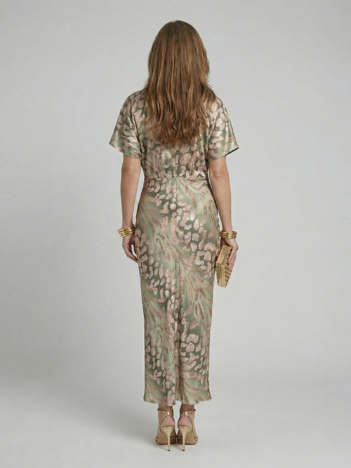 Flattering short sleeve women's green abstract print midi dress with a stylish V-neck and twist waist, perfect for spring.