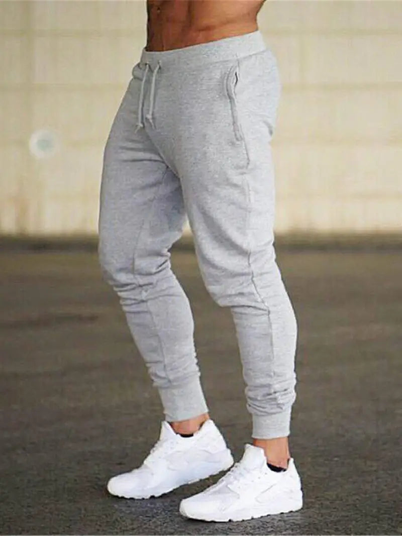 Men's comfortable gray athletic jogger pants with a relaxed fit and drawstring waist for casual wear.