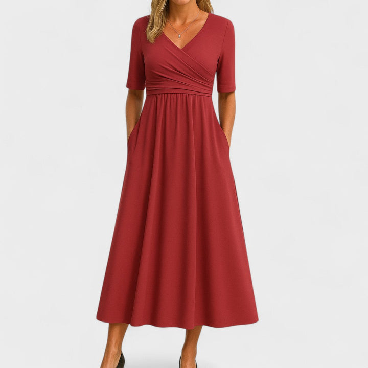 Women's flattering V-neck midi dress with short sleeves. Elegant chic fashion, ideal for summer parties & casual wear.