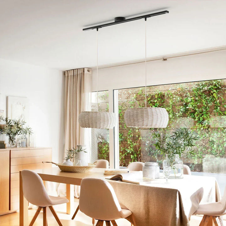 Black adjustable light track system. Modern pendant lighting for flexible home renovation.