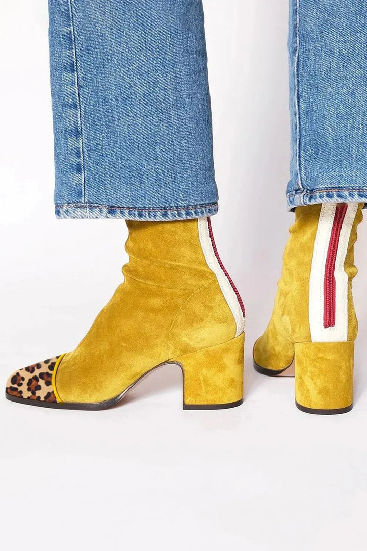 Trendy women's fashion ankle boots with a bold leopard print patterned toe and comfortable block heel.