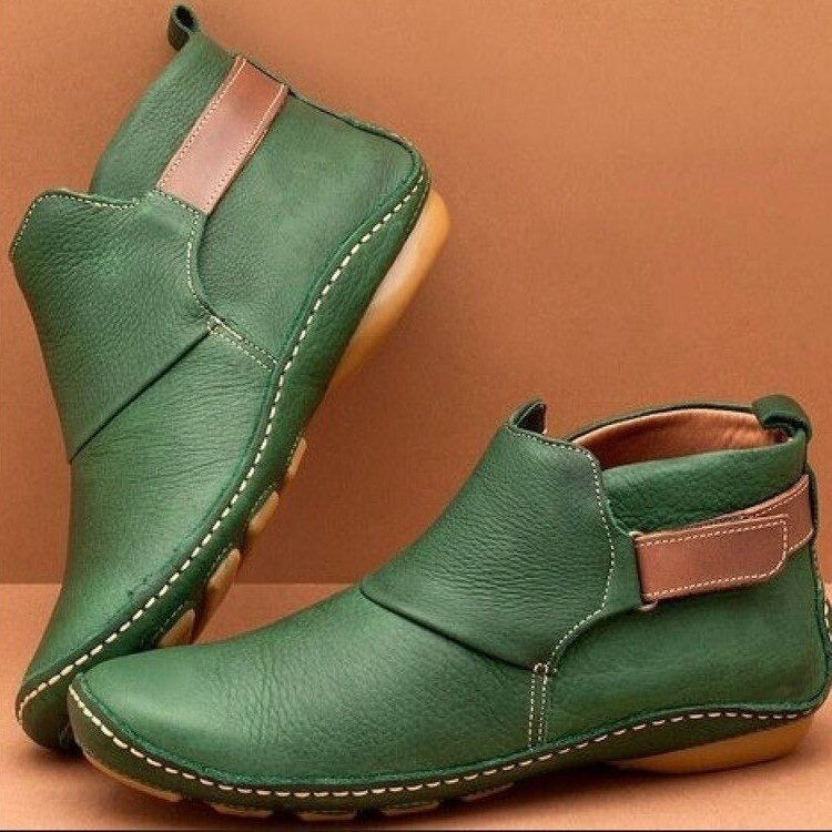 Stylish women's ankle boots with an adjustable strap, offering pull-on convenience & all-day comfort for fall fashion.
