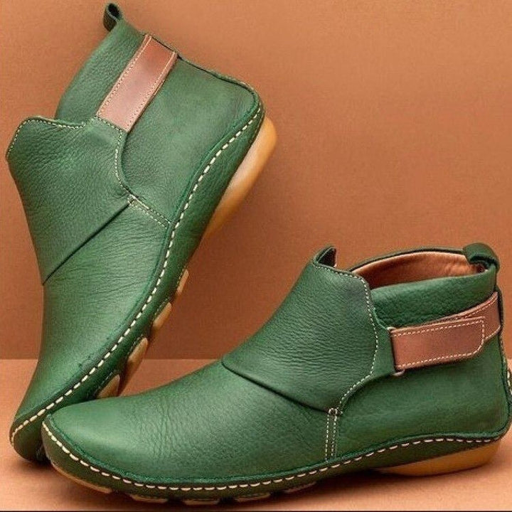 Stylish women's ankle boots with an adjustable strap, offering pull-on convenience & all-day comfort for fall fashion.