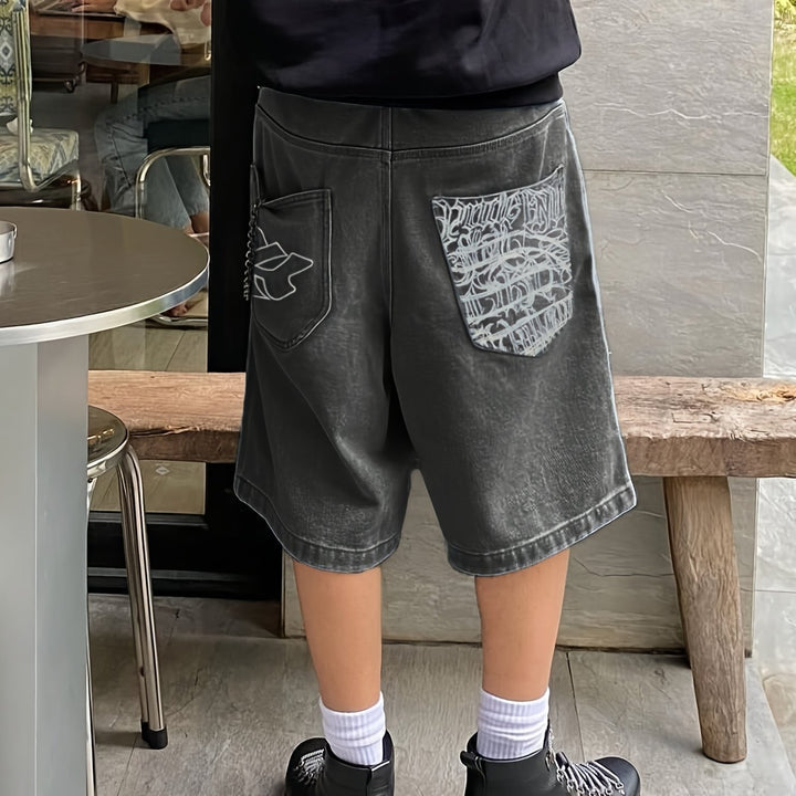 Casual men's denim shorts with elegant floral embroidery, a unique addition to any wardrobe.