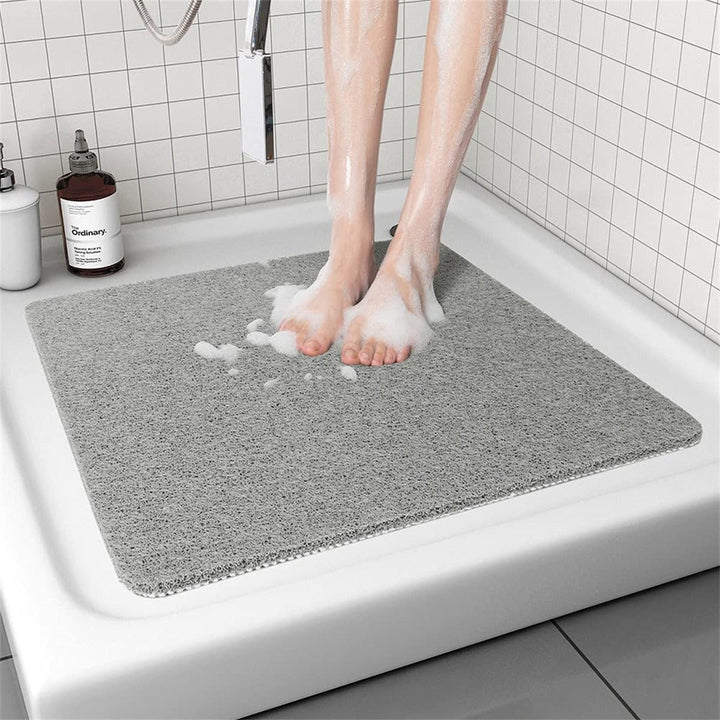 Unisex anti-slip hollow drainage bathroom mat for wet areas, ensuring home safety and quick drying.