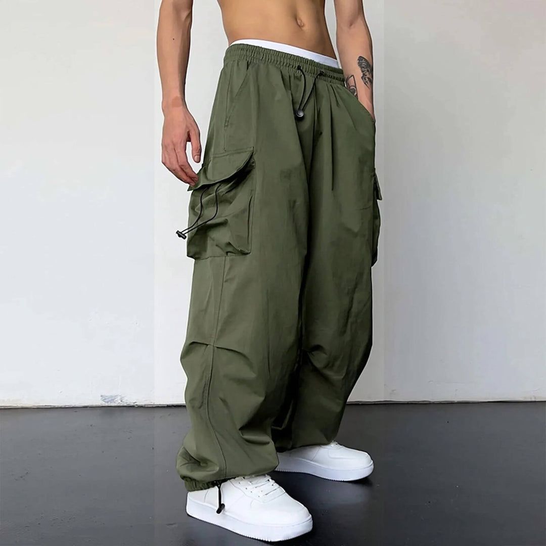 Model wearing black relaxed fit cargo joggers, showcasing comfortable fit for various activities.