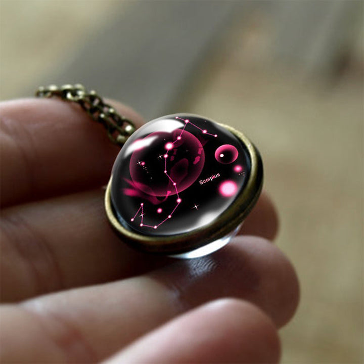 Collection of 12 Zodiac sign glass pendant necklaces for women, spiritual astrology protection jewelry.