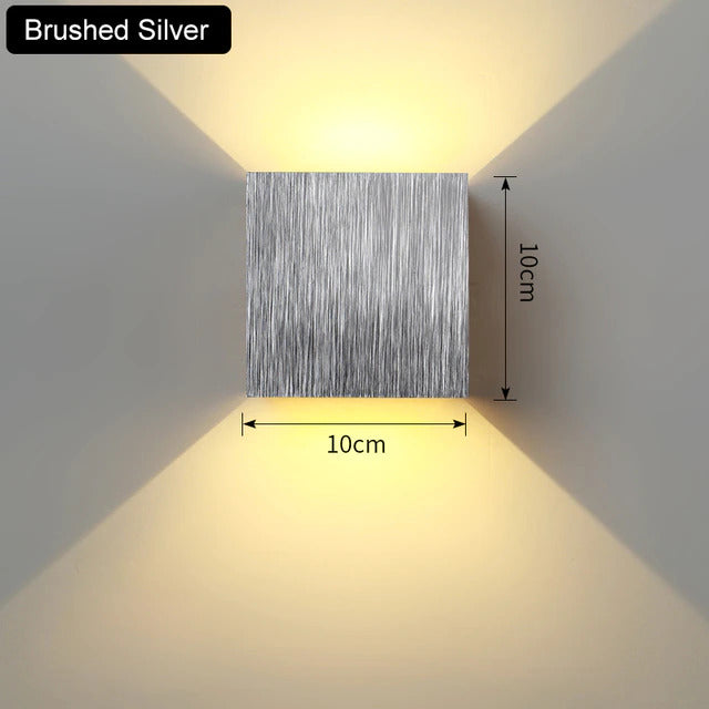 Sleek, modern LED wall sconce. Aluminum cube design provides beautiful up/down accent light for home decor.