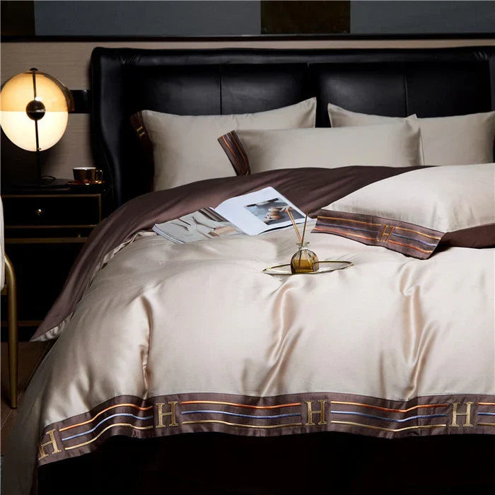 Complete luxury home linen set: embroidered cotton duvet cover, two pillowcases for stylish comfort.