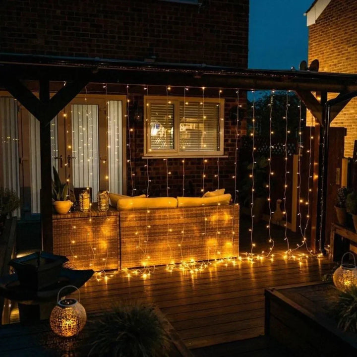 Bright warm white LED curtain string lights, ideal for festive and daily home decor.