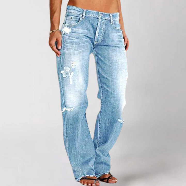 Bohemian-style women's loose wide-leg denim jeans. Comfortable low-rise casual pants for versatile everyday wear.