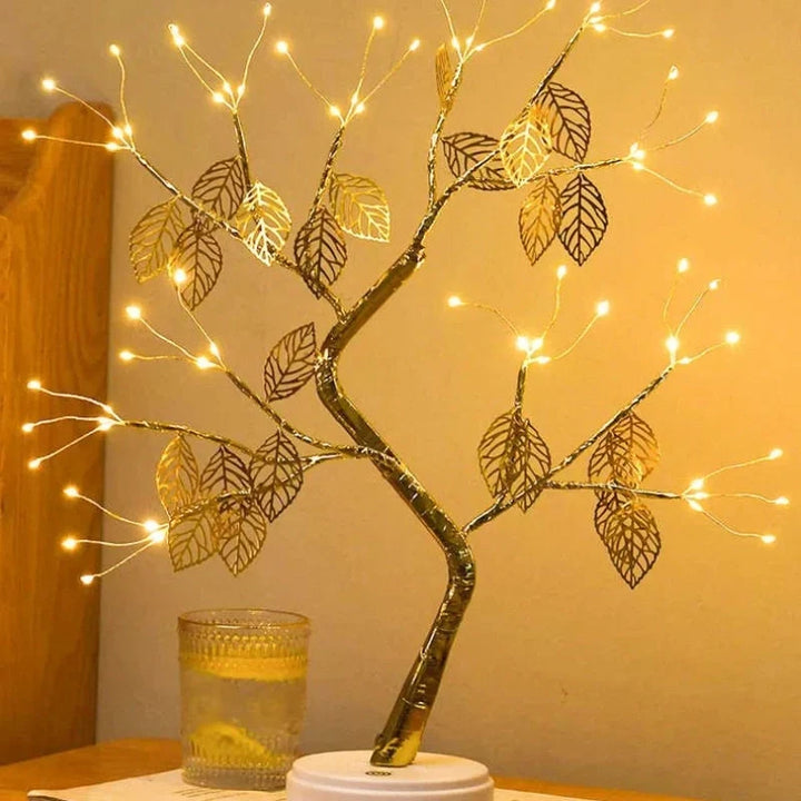 Vibrant LED golden leaf bonsai tree lamp, a warm white decorative light for cozy ambient lighting and home decor.