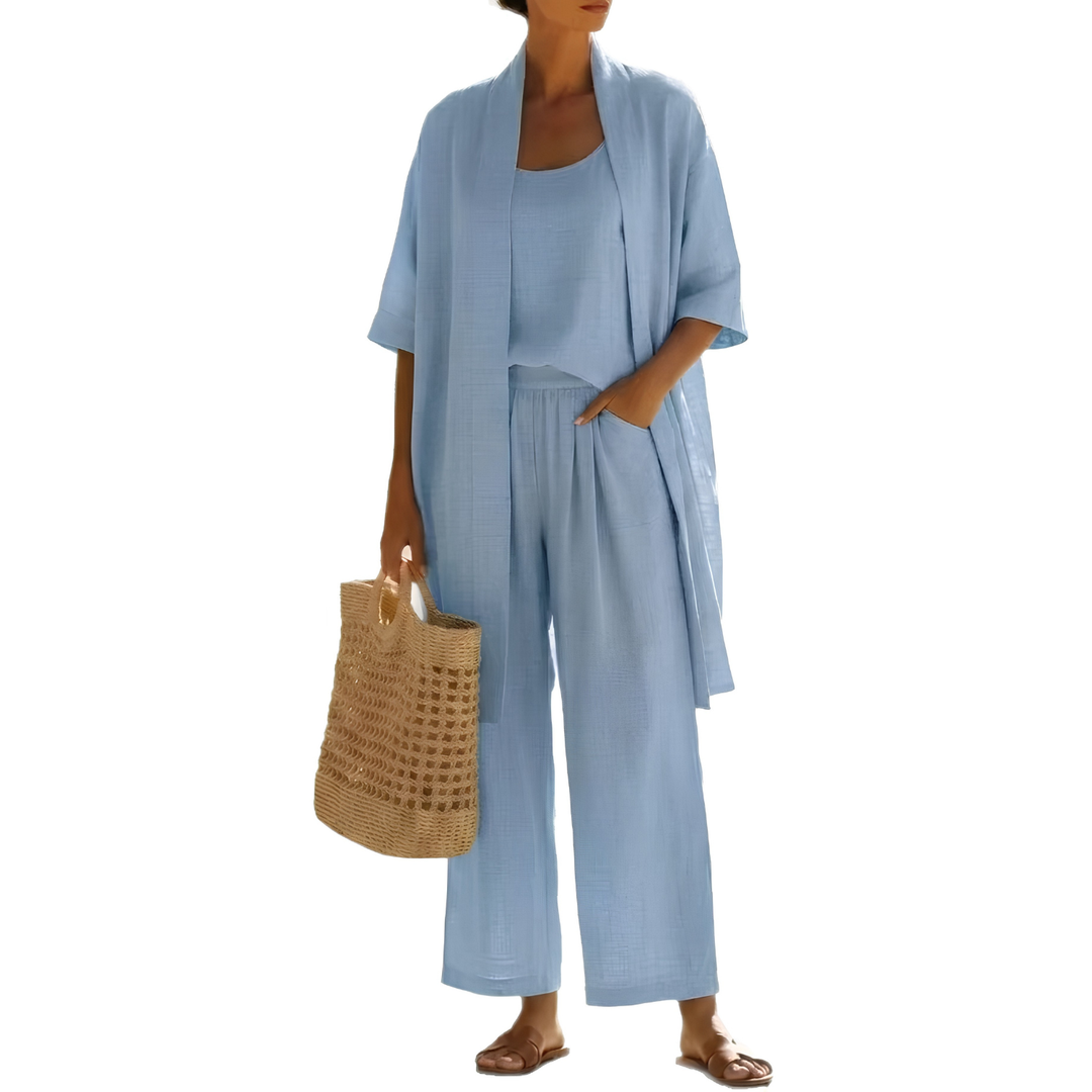 Fashionable women's 3-piece matching outfit: long cardigan, sleeveless top, straight leg trousers.