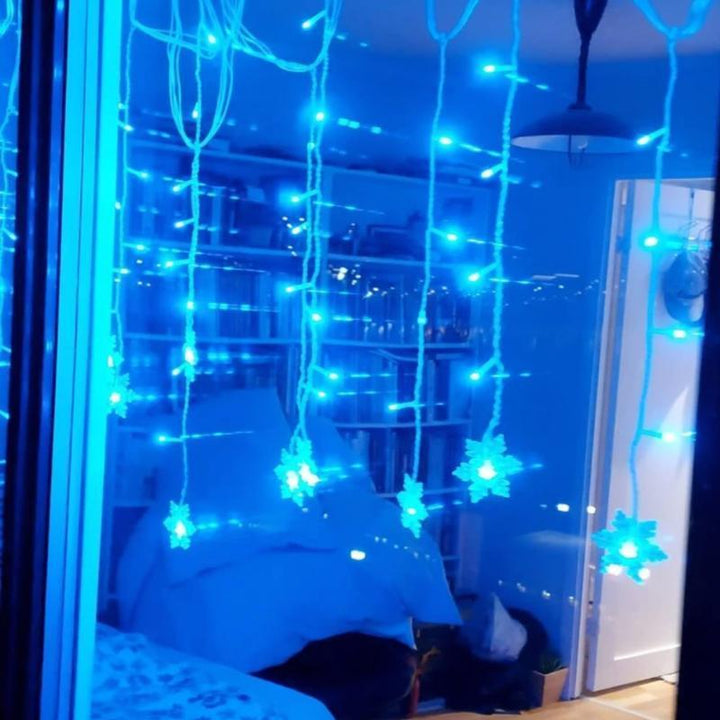 Festive LED snowflake fairy lights for enchanting holiday and winter home decorations.