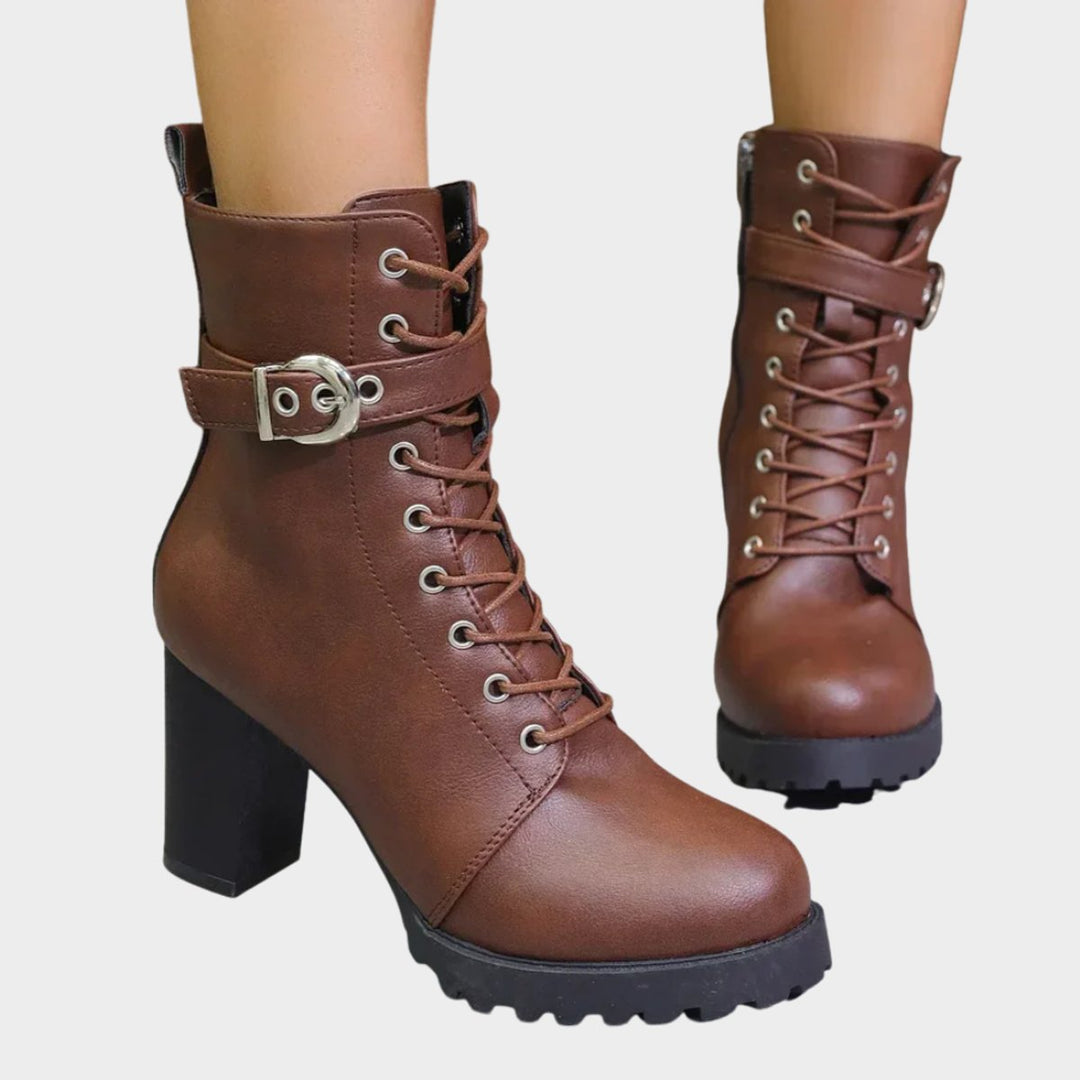 Women's lace-up combat ankle boots with chunky block heel. Edgy, versatile footwear for fall fashion.