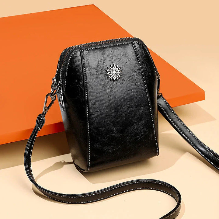 Versatile green leather shoulder bag for women, a chic fashion accessory with an adjustable strap.