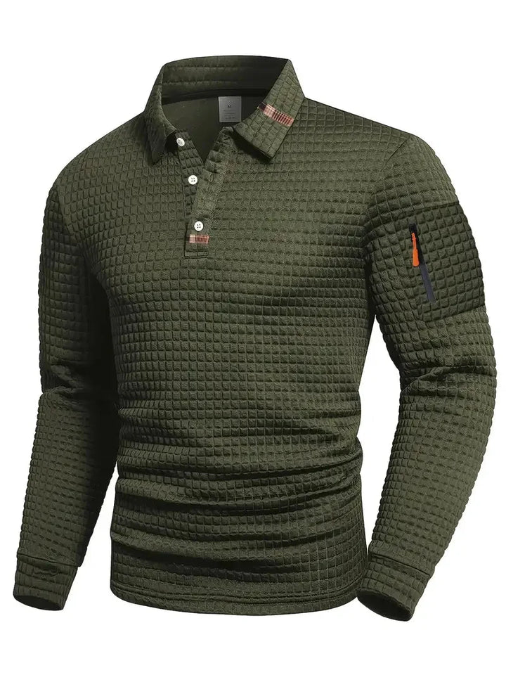 View of a men's elegant long-sleeve polo shirt, showcasing its subtle texture and sleeve pocket detail.