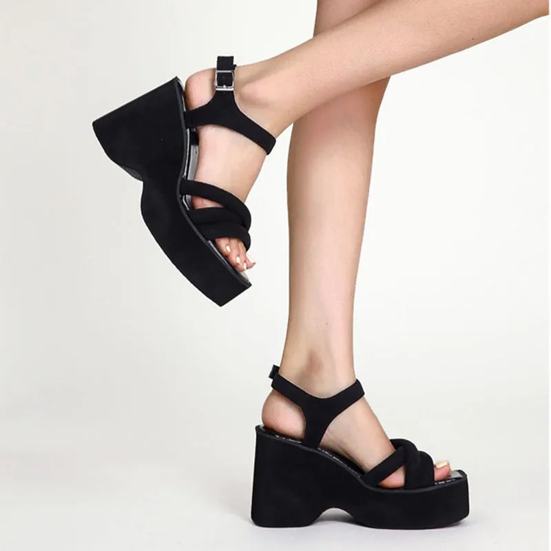 Chic Carmela women's black sandals with elegant straps, ideal for stylish summer footwear & comfort.