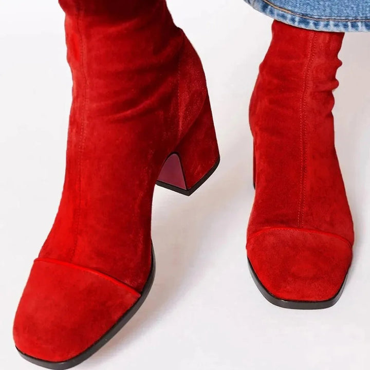 Versatile women's block heel ankle boots with a distinctive leopard print toe, ideal for casual or dress.