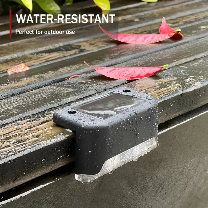Solar LED step lights with warm glow for outdoor pathways & safety.